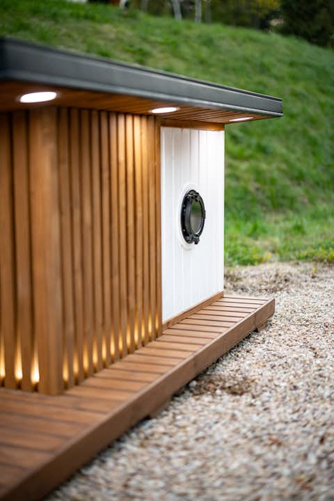 Thermally insulated dog kennel with underfloor heating and exterior LED lighting.