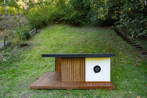 Thermally insulated dog kennel with underfloor heating and exterior LED lighting.